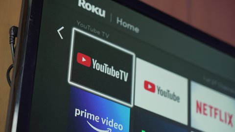 Circa May, 2021 - A closeup view of the YouTube TV app launching on a wall-mounted Roku television. In May of 2021, Roku and YouTube TV were in a contract dispute.