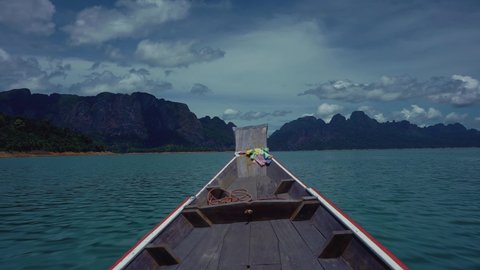 Long tail boat on the Cheow Lan Lake, Khao Sok, Thailand