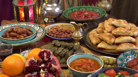 Ramadan Fasting, Iftar food. Moroccan cuisine. Eid al-Adha. Muslim people gathering to break their fast together. The meal is taken just after the call to prayer Maghrib, which is around sunset