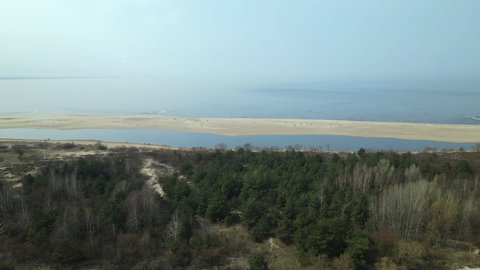 Aerial view - Coastline of Nature Reserve Mewia Lacha and Baltic Sea, Poland nature, drone turning around shot