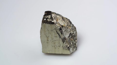 natural silver pyrite gemstone on the white turning table