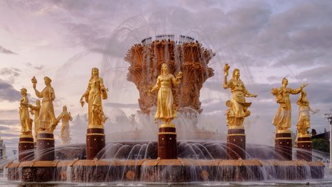 Fountain Friendship of peoples at sunset. One of the main symbols of the Soviet era. Sixteen female statues of the fountain represent the 16 Soviet republics. Timelapse. Moscow. Russia.