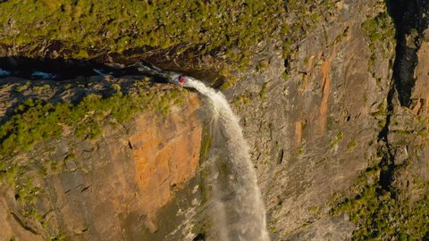 Spectacular aerial view of a tourist standing and admiring the magnificent beautiful Tugela Falls, second highest waterfall in the world,Drakensberg, KwaZulu-Nata,South Africa