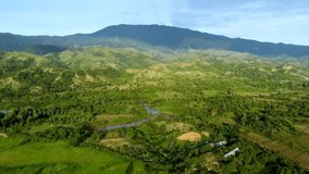Aerial landscape with green fields and hills in Aceh Province, Indonesia