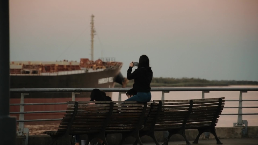 
Group of young people enjoying the bay at sunset