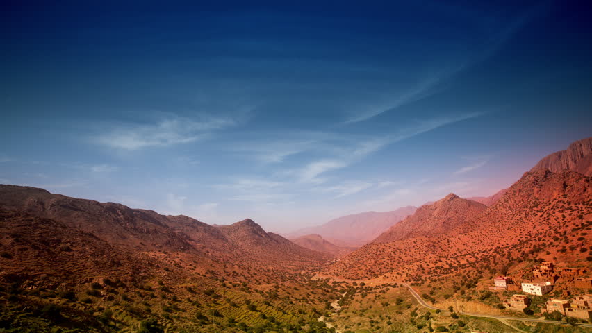4k timelapse looking down onto lush valley mountain landscape in morocco anti-atlas