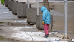 Child Walking Along Snowy Path. High quality video footage