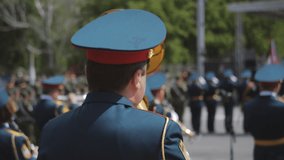 A wind instrument military parade - soldiers standing on the street and playing instruments - Powered by Shutterstock - Get 15% off with code: PIKWIZARD15