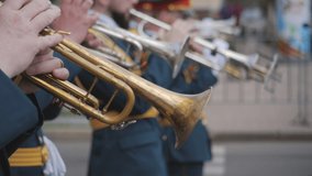 Close-up of wind instruments. A military band plays brass instruments at a military parade or city festival. Brush tool. - Powered by Shutterstock - Get 15% off with code: PIKWIZARD15
