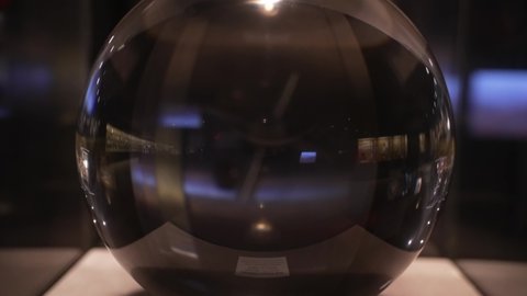 This tilt video features a large and flawless crystal ball on display.