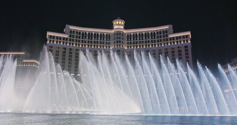 Las Vegas, Nevada USA, March 2021. Dancing fountains show 4K footage. Fountains at Bellagio Resort and Casino on world famous Las Vegas the Strip. Capital of night life and adult entertainments