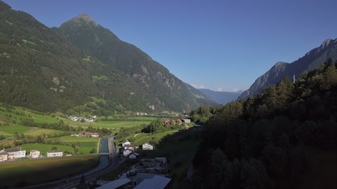 Aerial panorama of Val Poschiavo valley and Lago di Poschiavo lake near Bernina Pass, Graubunden, Switzerland. 2.5x speeded up from 24 fps.