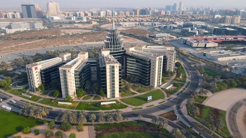 Dubai, United Arab Emirates - May 6, 2021: Left side orbit of Dubai Silicon Oasis technology park, residential area and free zone in Dubai emirate suburbs at United Arab Emirates aerial view