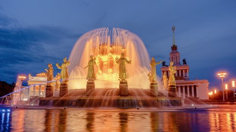 Fountain Friendship of peoples at night. One of the main symbols of the Soviet era. Sixteen female statues of the fountain represent the 16 Soviet republics. Timelapse. Moscow. Russia.