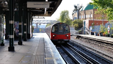 LONDON, UK - MAY 5, 2021: A Jubilee line train arrives on the platform at Willesden Green station in North West London, UK.