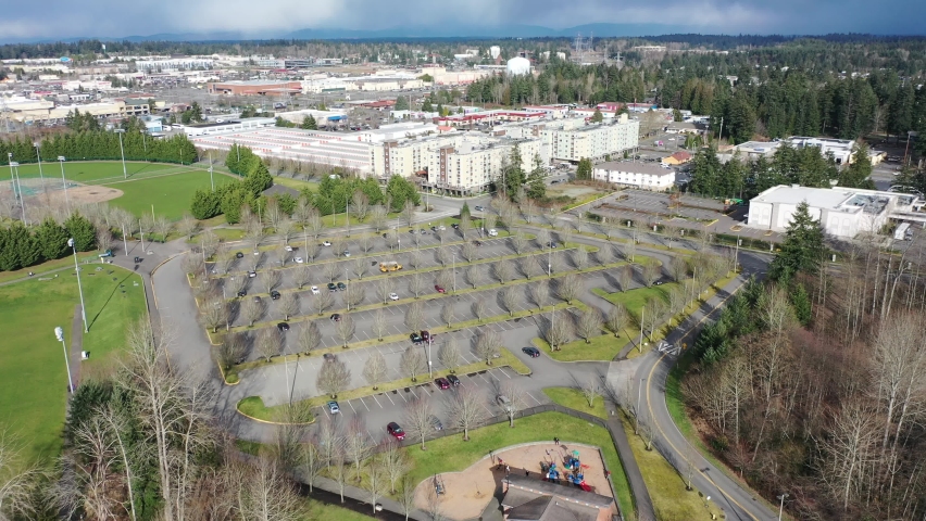 Cinematic aerial drone dolly shot of Celebration Park and The Commons At Federal Way, a large commercial, shopping area in King County between Tacoma and Seattle, Washington