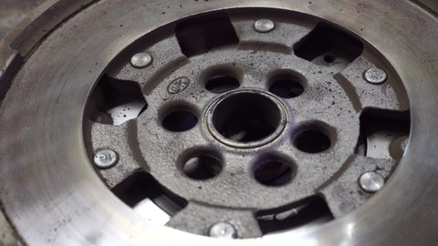 Detail of old Car flywheel in a workshop, car spare parts