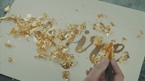 Inspire. Motivating lettering on white board. Handmade creativity. Gold letters. Gilding. Brush in hand - Powered by Shutterstock - Get 15% off with code: PIKWIZARD15