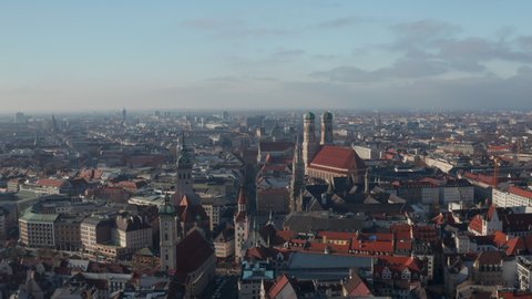 The Famous German Cathedrals Frauenkirche, New Town Hall and St. Peter's Church in City Center of Munich, Germany with View of Marienplatz, Aerial Dolly slide right