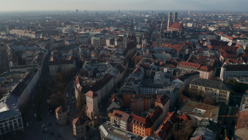 Famous Isa Tor City Gate in Munich, Germany with little traffic due to Coronavirus Covid 19 Pandemic, Aerial View above German Cityscape with Frauenkirche and New Town Hall
