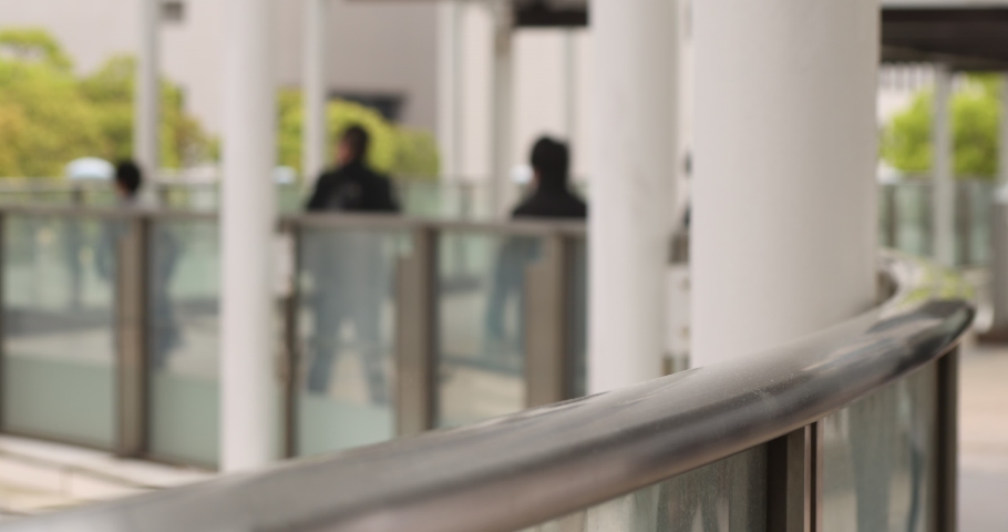 A slow motion of walking office workers at urban city in Shinagawa defocused