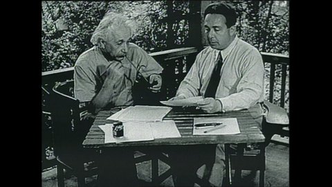1940s: Albert Einstein sits on deck with man. Typewritten letter from Einstein to Roosevelt. Roosevelt at desk. Sign National Bureau of Standards. Roosevelt at desk.