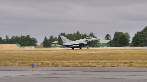 Evreux Air Base France JULY, 14, 2019 Eurofighter Typhoon of Royal Air Force RAF taking off from the runway. Follow shot