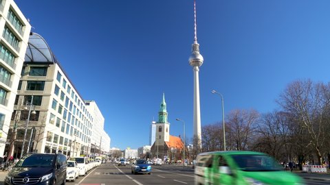 KARL LIEBKNECHT STRASSE, BERLIN, GERMANY – 16 FEBRUARY 2019: Sunny daytime view along Karl Liebknecht Strasse towards Berliner Fernsehturm Television Tower, Berlin, Germany