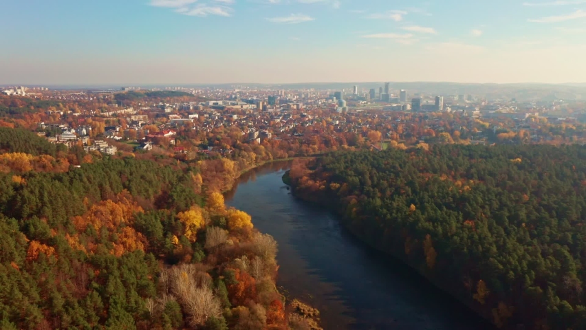 Aerial view of the river and the city center, the river Neris runs through the city Vilnius, capital of Lithuania. Beautiful autumn landscape. Royalty-Free Stock Footage #1072130555