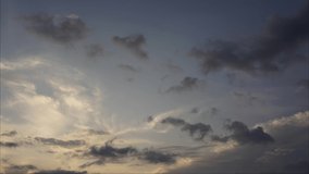 Yellow dark sunset sky and clouds timelapse motion video of fast flying.