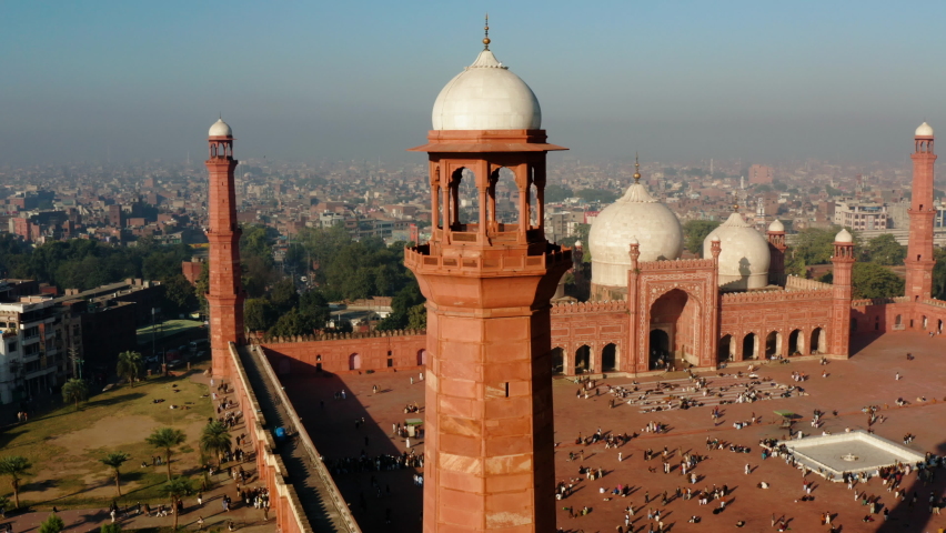 People On Vast Courtyard Of Badshahi Mosque In Lahore Fort, Lahore, Punjab Province, Pakistan. - Aerial Drone Shot
