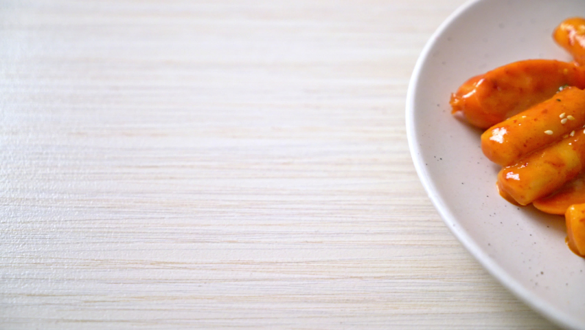 Korean rice cake stick with sausage in spicy sauce - Tteokbokki