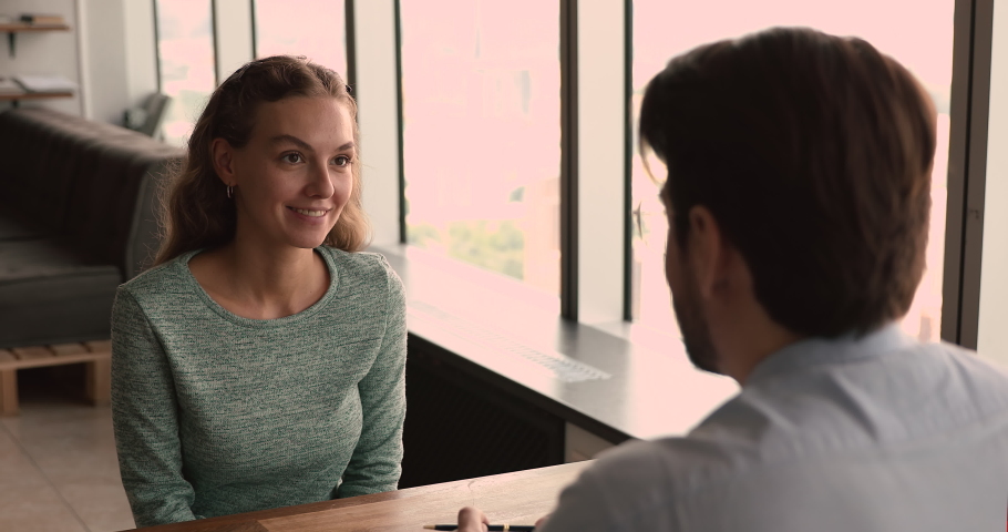 Applicant passes job interview talk to company HR manager in office, during recruiting smiling woman feels confident give answers to questions applying for position. Staffing, human resources concept Royalty-Free Stock Footage #1072143620