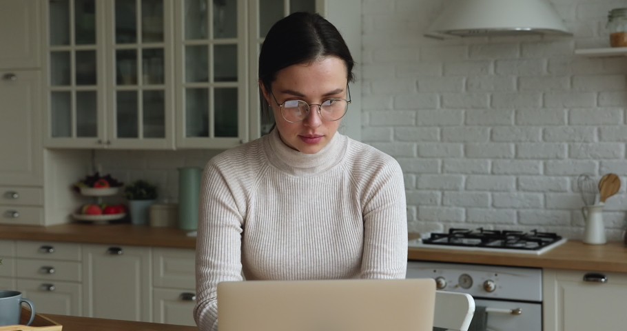 Young woman feel tired due long time working on laptop takes off glasses rubbing nose bridge reducing eye strain. Modern tech negative influence to eye health, overworking, dry eyes need drops concept Royalty-Free Stock Footage #1072143773