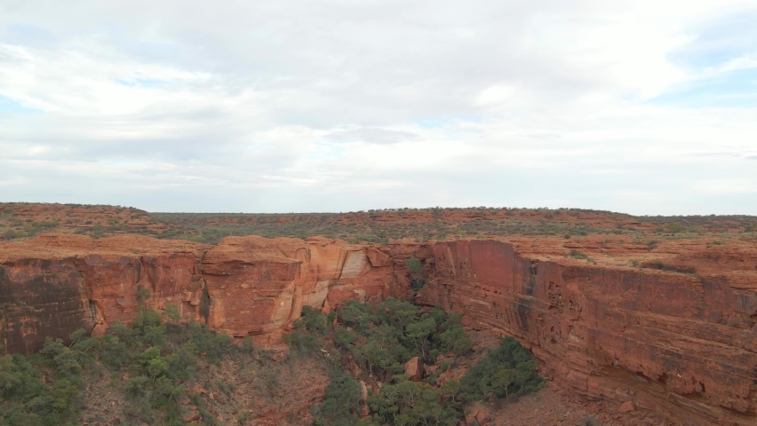 Red Cliffs And Plateau Of Kings Canyon In Australia - Kings Canyon Walk In Watarrka National Park. - aerial