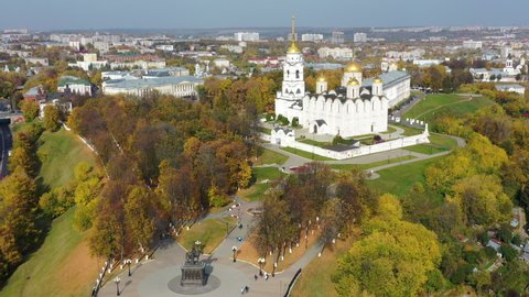 Vladimir town, Russia - 5th October, 2020: Attractions of the town. Aerial footage of Prince Vladimir monument and Assumption (Uspensky) cathedral on sunny day. 