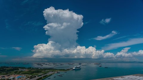 Giant cumulonimbus clouds explode at the ocean