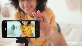 Art Bloggers, Online Lesson Recording, Woman Blogger, Playing Guitar. Cheerful afro american woman blogger playing guitar while sitting using mobile phone - Powered by Shutterstock - Get 15% off with code: PIKWIZARD15
