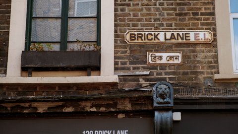 LONDON, circa 2021 - The street sign of Brick Lane, a street in East London, UK famous for its curry houses and the heart of the Bangladeshi community
