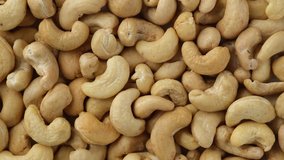 raw cashew nuts top view. Sliding shot. 4K UHD video