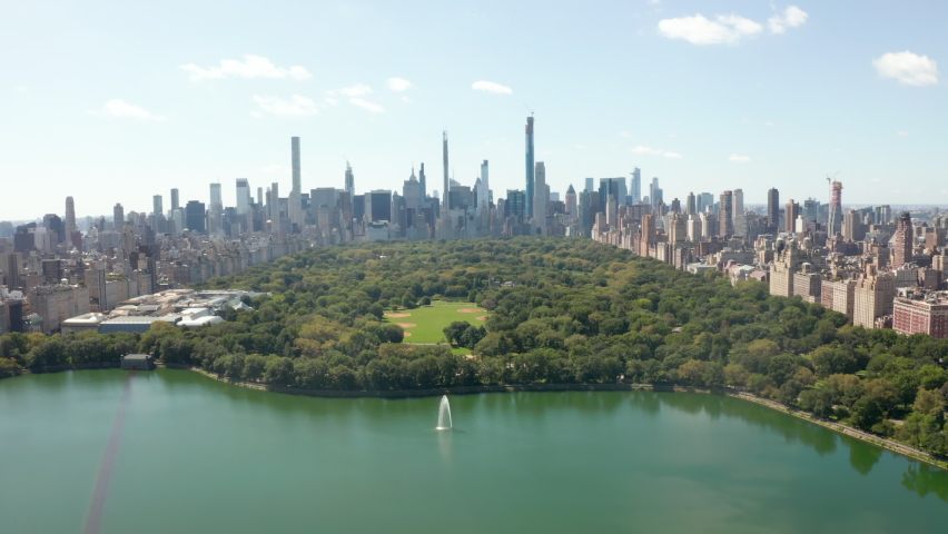 Manhattan Skyline with Tall Skyscraper Tower Buildings, Wide View from Central Park in Summer, Aerial Drone Shot Royalty-Free Stock Footage #1072173851