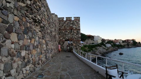 SOZOPOL, BULGARIA, JULY 2020: Timewarp of Family Walking as Tourists in Sozopol Old Historical Sea Town with Medieval Fortress