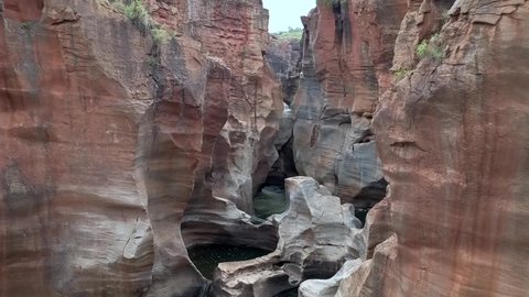 HD aerial drone footage of Bourke's Luck Potholes. Beautiful natural rock formations hewn by centuries of water flow by the Blyde River creating these canyons in Graskop, Mpumalanga, South Africa.