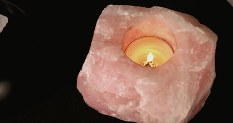 Close up details of a crystal ball candle magick ritual