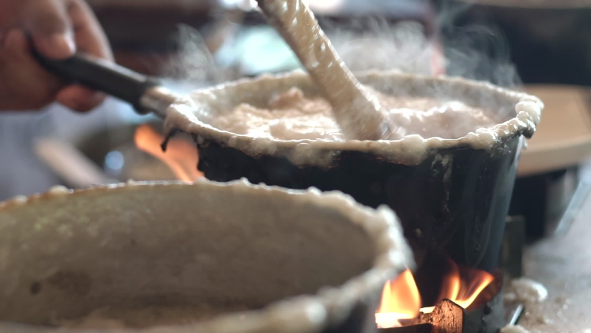 Tradition rice porridge on the table served with dough stick and boiled egg. Best breakfast in the morning, Healthy and clean food good taste ideas concept. Royalty-Free Stock Footage #1072208033