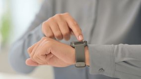 Close Up of African Woman using Smart Watch  - Powered by Shutterstock - Get 15% off with code: PIKWIZARD15