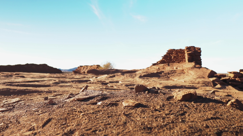 Low angle panning shot of landscape at Wukoki Pueblo Royalty-Free Stock Footage #1072213502