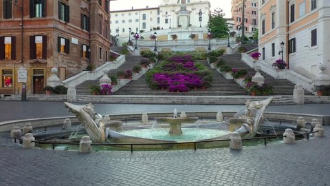 Piazza di Spagna in Rome, The Spanish Steps with flowers. Trinità dei Monti. Spectacular aerial drone shot of flower covered stairway on a spring day. Center city of Roma, Italy.