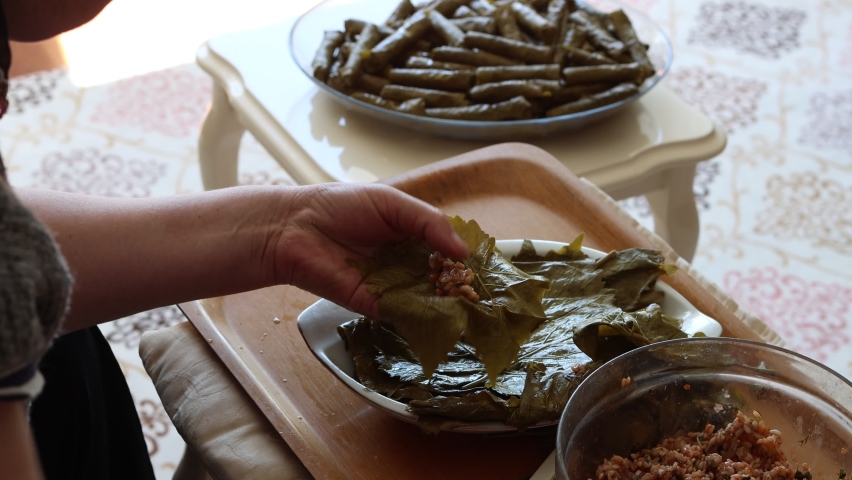 Turkish traditional Yaprak Sarma, stuffed grape leaves with rice and meat. Royalty-Free Stock Footage #1072220564