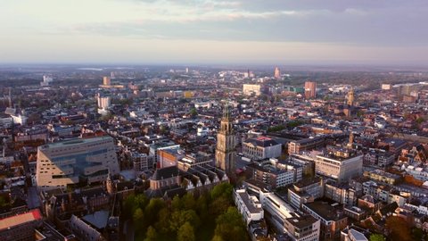 GRONINGEN, NETHERLANDS - 07. MAY 2021: City center and Martinitoren Church Tower with clear view of the Forum as seen from the air.